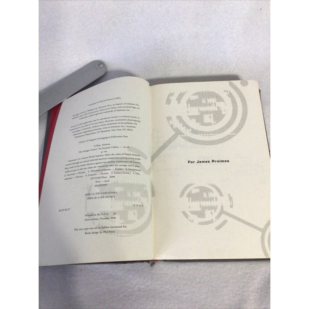 Scholastic The Hunger Games Suzanne Collins First Edition Hardcover‎ Grey Good